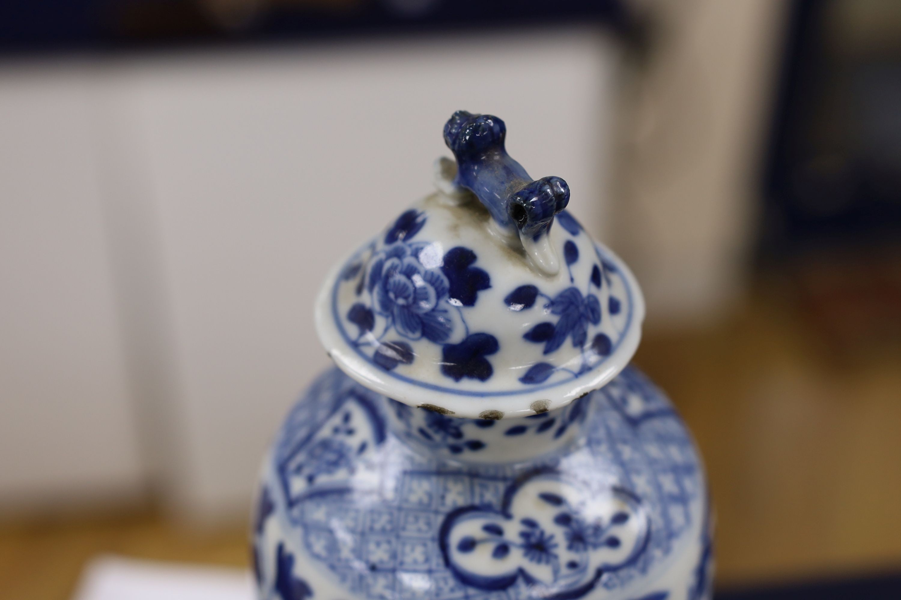 A pair of Chinese blue and white dragon vases and covers, circa 1900. 28cm